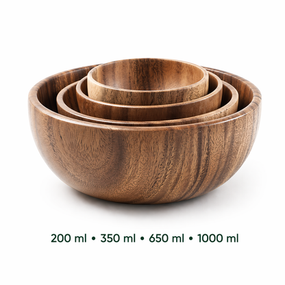 Set of three wooden bowls with varying capacities on a white background