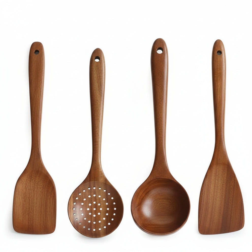 Set of four wooden kitchen utensils with handles on a white background