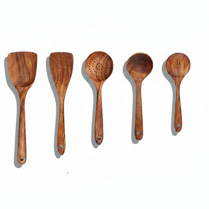 Wooden cooking utensils with measurements on a white background
