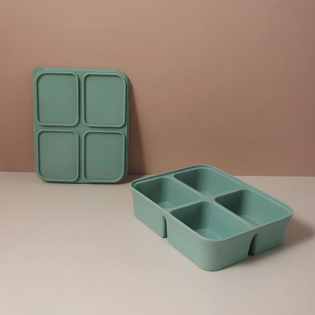Green compartmentalized tray with dimensions on a beige background