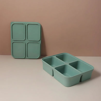 Green compartmentalized tray with dimensions on a beige background