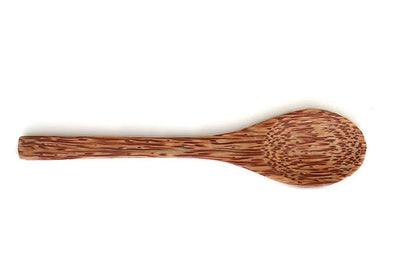 Wooden spoon with measurements on a white background