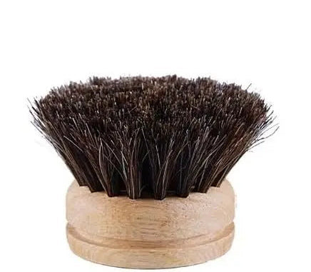 Horsehair brush head with wooden handle on a white background